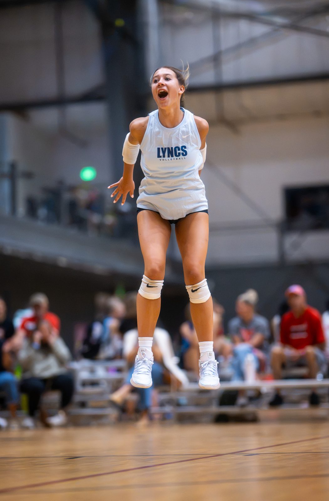 A player in light blue shouts in celebration